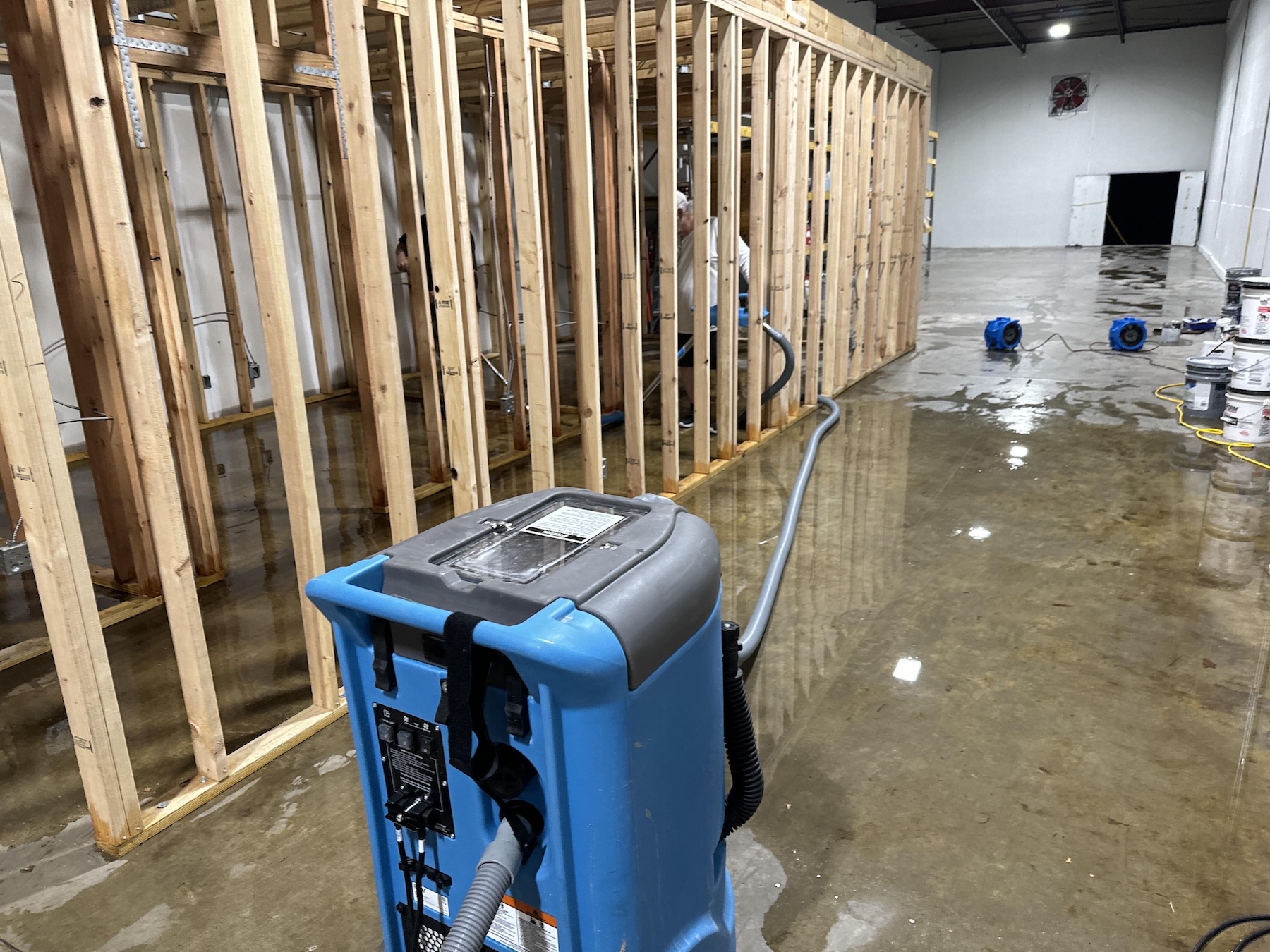 Commercial framing exposed and saturated after storm intrusion in Louisville