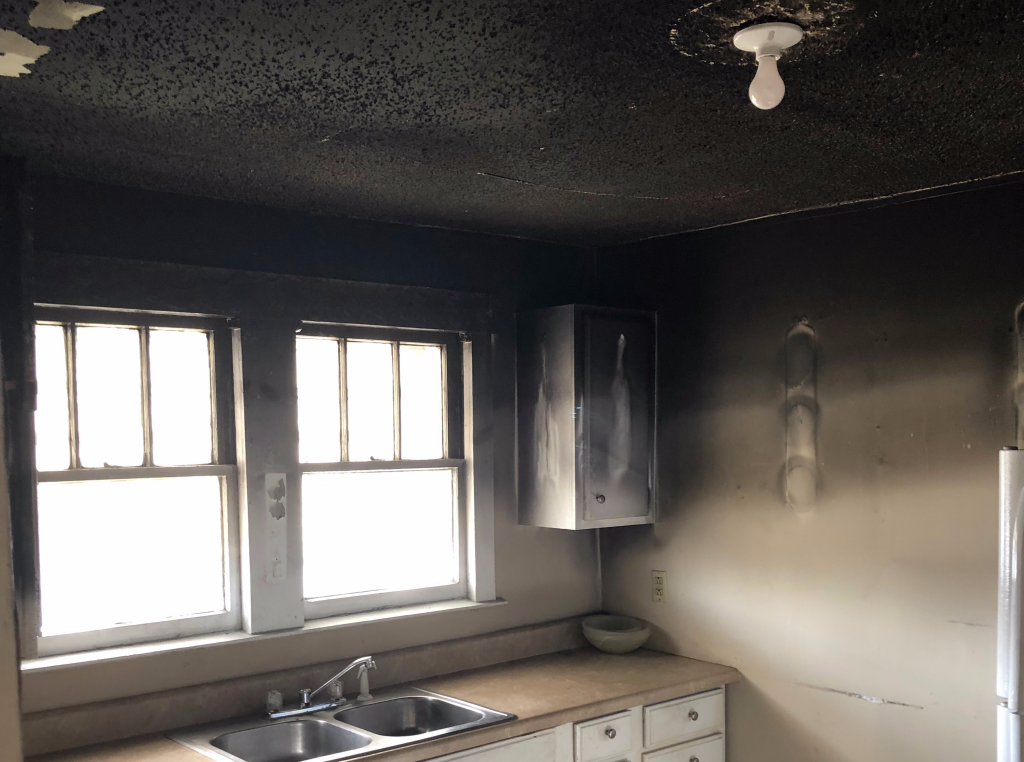 Heavy smoke and soot damage in a Louisville kitchen after a fire
