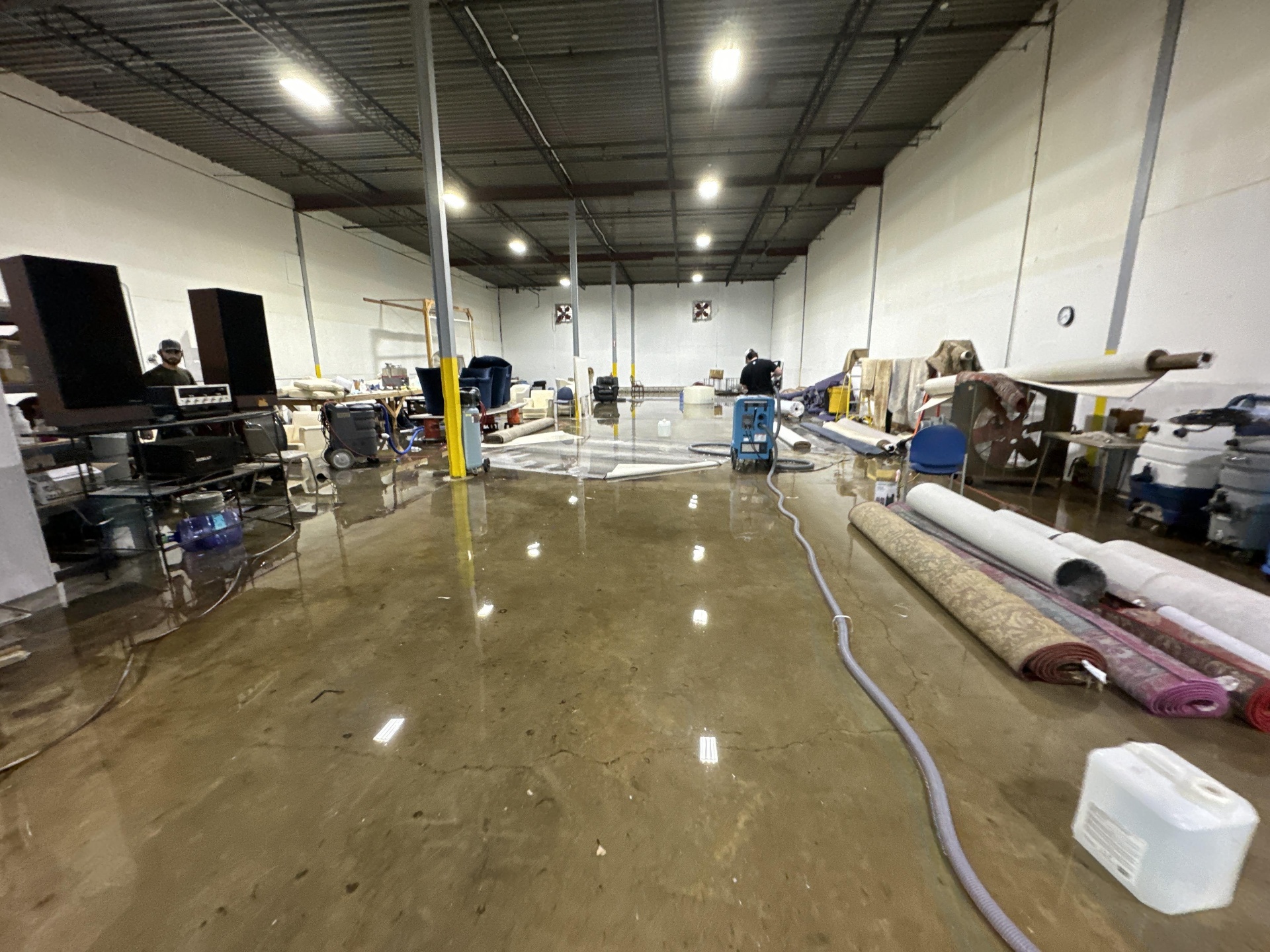 Flooded warehouse contents being staged for pack-out