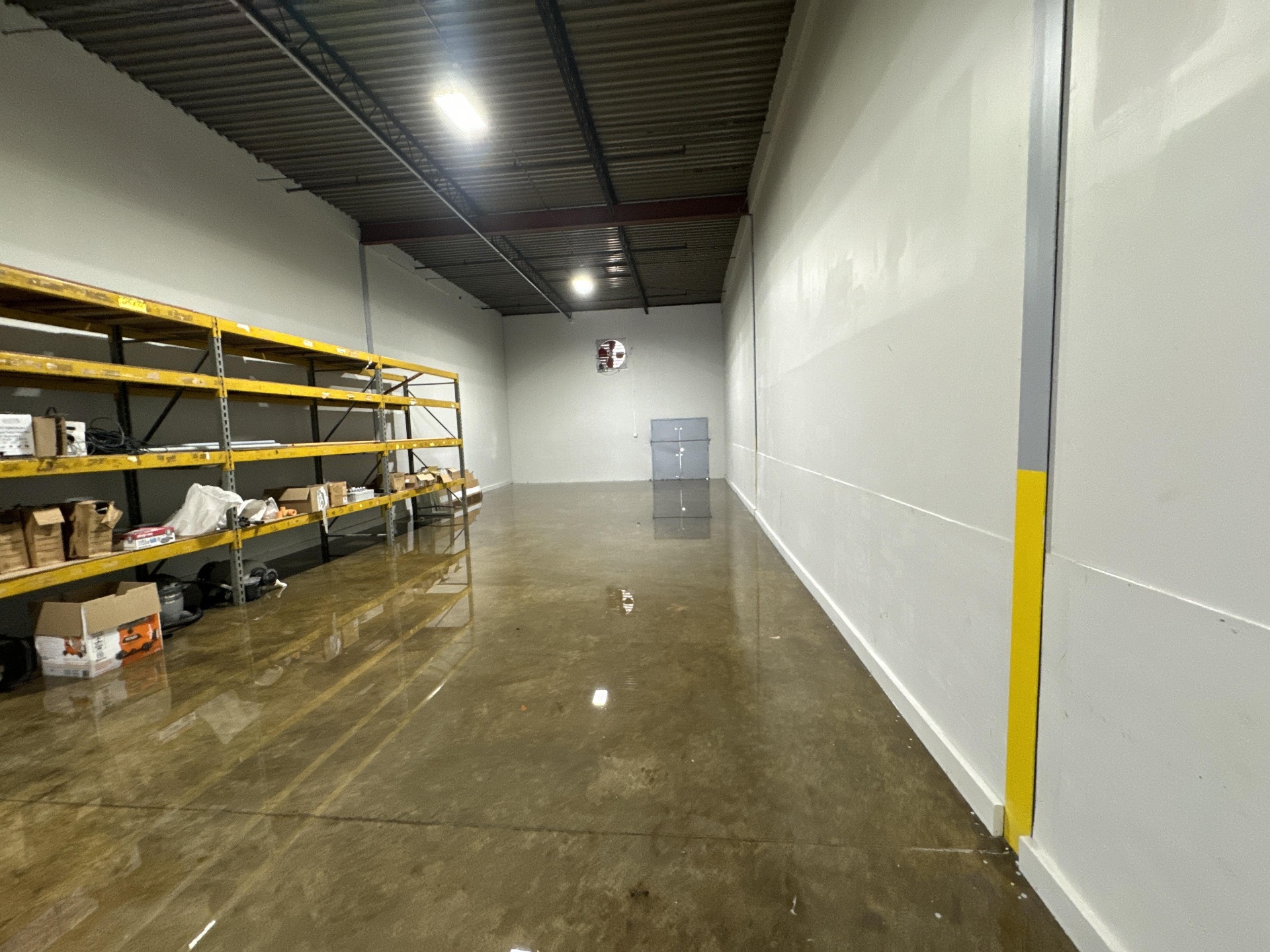 Warehouse shelves flooded after a storm event in Louisville